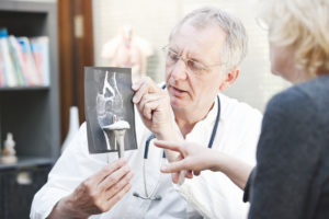 Orthopedic doctor explaining knee x-ray