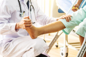 Doctor Examining Patient Leg Problem In Orthopedic care