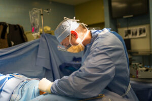Orthopedic doctor doing knee surgery